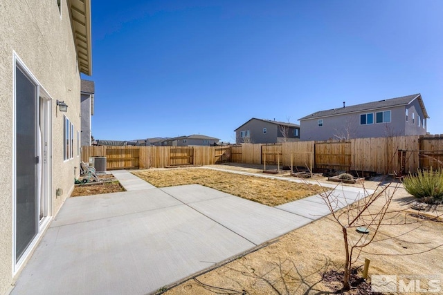 view of patio featuring a fenced backyard and central air condition unit