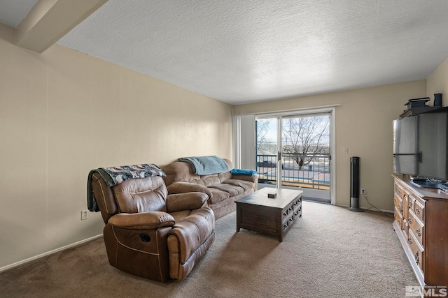 living area featuring a textured ceiling, carpet flooring, and baseboards