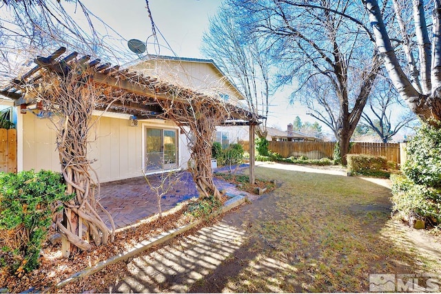 view of yard featuring a patio area and fence