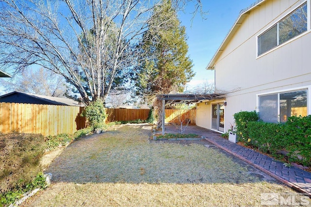 view of yard with a patio area and a fenced backyard