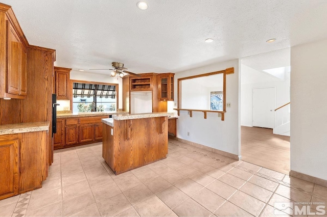 kitchen with brown cabinets and light countertops