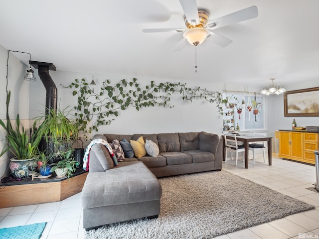 living area featuring light tile patterned floors and a ceiling fan