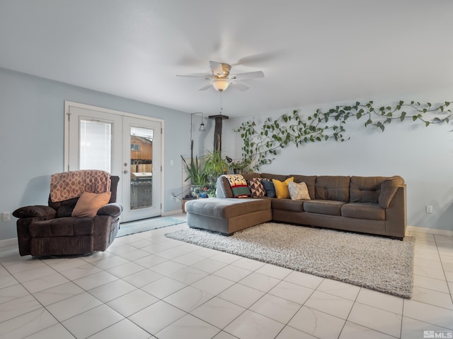 living area featuring a ceiling fan, french doors, baseboards, and light tile patterned floors