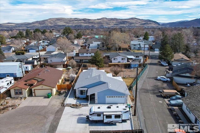 drone / aerial view with a residential view and a mountain view