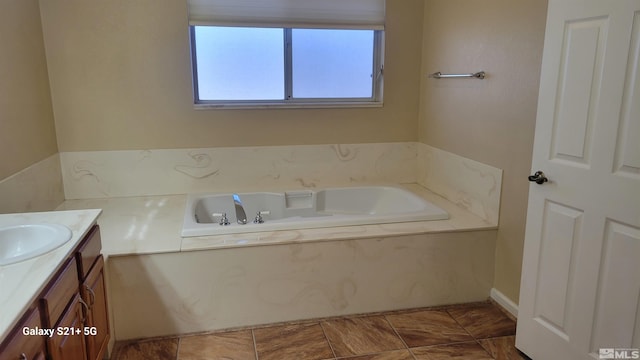 full bathroom featuring a bath and vanity