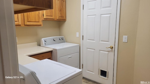 laundry area with cabinet space and washing machine and clothes dryer