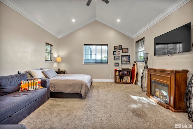 bedroom featuring carpet floors, crown molding, a glass covered fireplace, vaulted ceiling, and baseboards