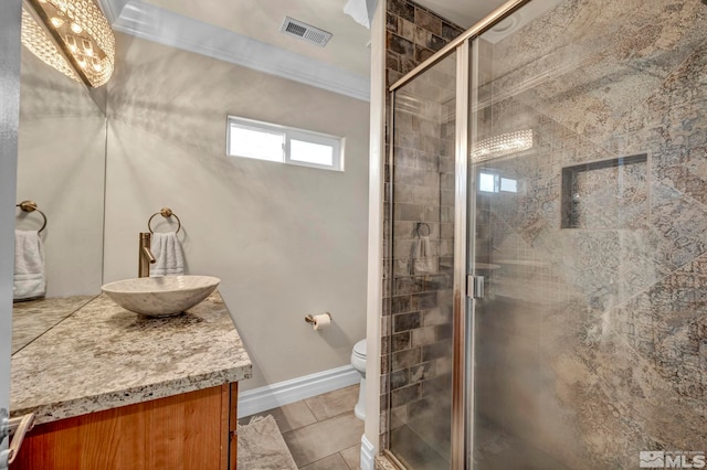 bathroom with toilet, vanity, visible vents, and a shower stall