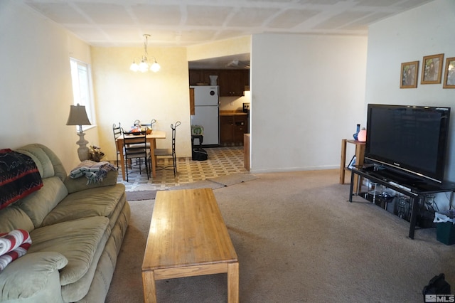 living area with light colored carpet, baseboards, and an inviting chandelier