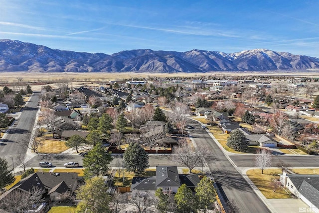 drone / aerial view featuring a residential view and a mountain view