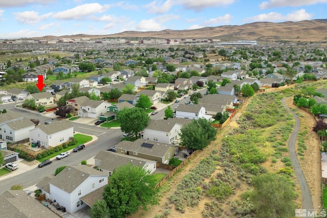 drone / aerial view featuring a residential view and a mountain view