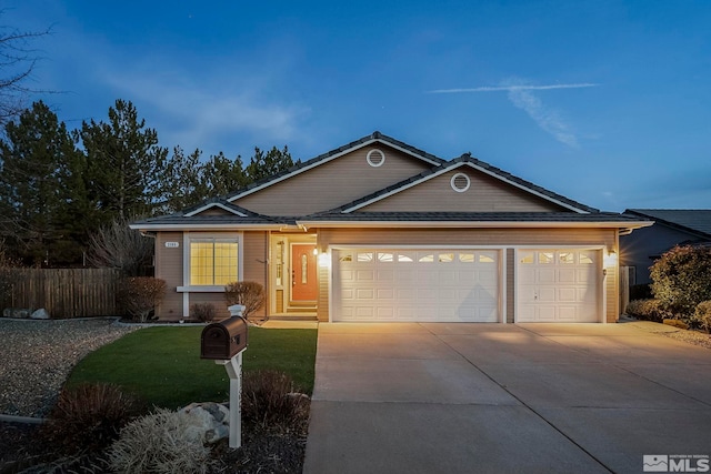 single story home with a garage, concrete driveway, and fence