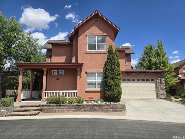 traditional-style home with stucco siding, covered porch, an attached garage, crawl space, and driveway