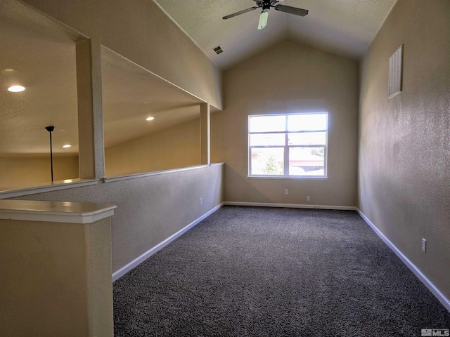 additional living space with baseboards, visible vents, a ceiling fan, lofted ceiling, and carpet floors