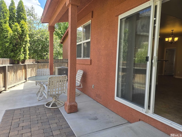 view of patio featuring fence private yard, visible vents, and outdoor dining space