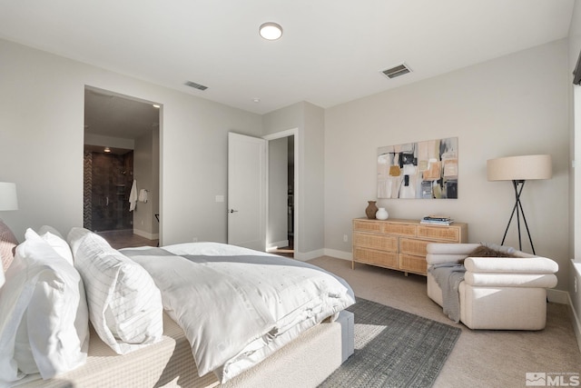 bedroom with carpet floors, visible vents, and baseboards