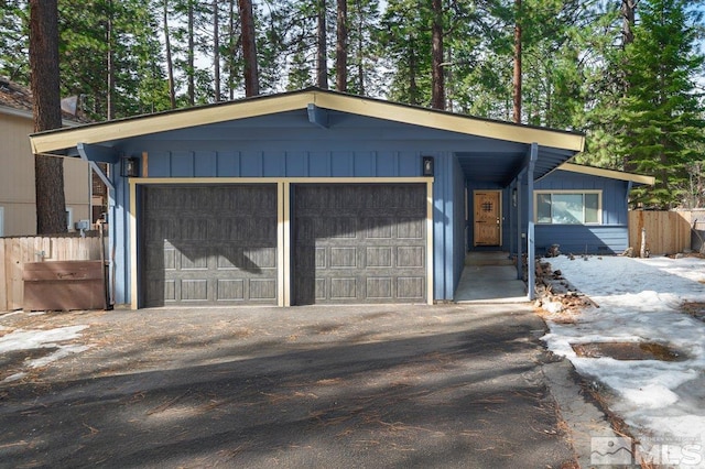 garage featuring aphalt driveway