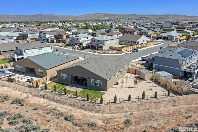 bird's eye view with a residential view and a mountain view