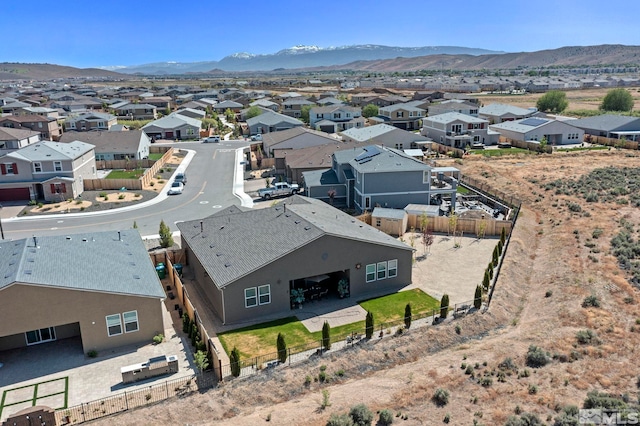 drone / aerial view featuring a residential view and a mountain view