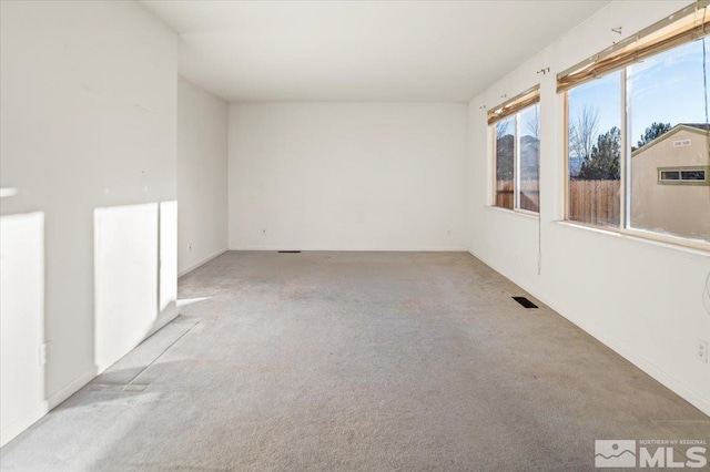 empty room featuring light carpet and visible vents