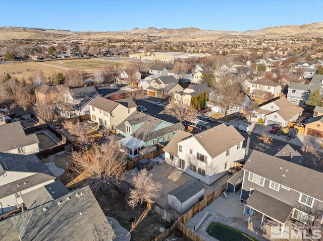 drone / aerial view featuring a residential view and a mountain view