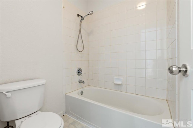 bathroom with toilet and shower / bathtub combination