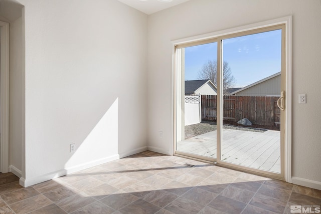 entryway featuring baseboards