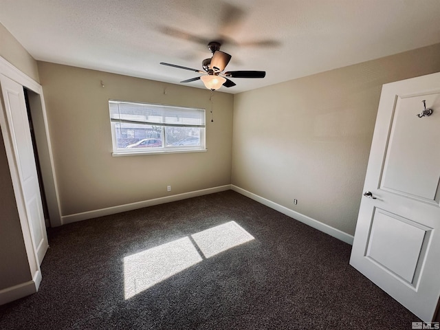 unfurnished bedroom with ceiling fan, baseboards, and a textured ceiling