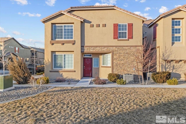 view of front of house featuring cooling unit, stone siding, a residential view, and stucco siding