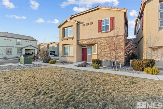 view of front of home featuring stone siding, central AC, a front yard, and stucco siding