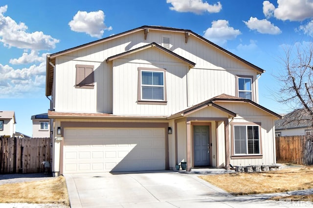 view of front facade featuring a garage, concrete driveway, and fence