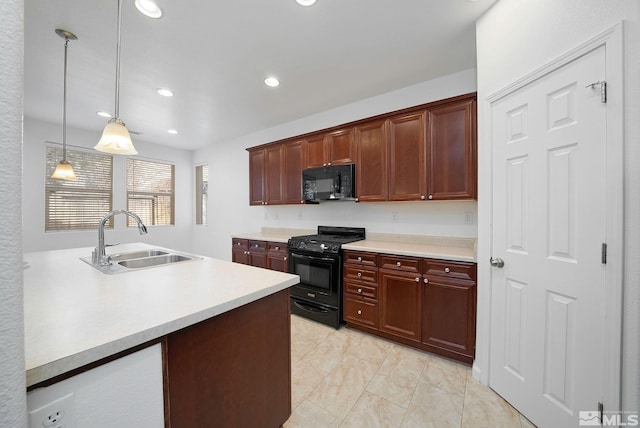 kitchen featuring hanging light fixtures, light countertops, black appliances, a sink, and recessed lighting