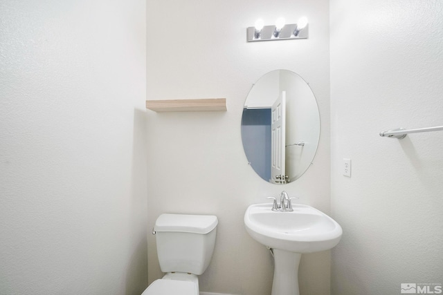 bathroom featuring toilet