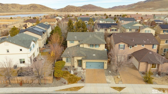 bird's eye view with a residential view and a mountain view