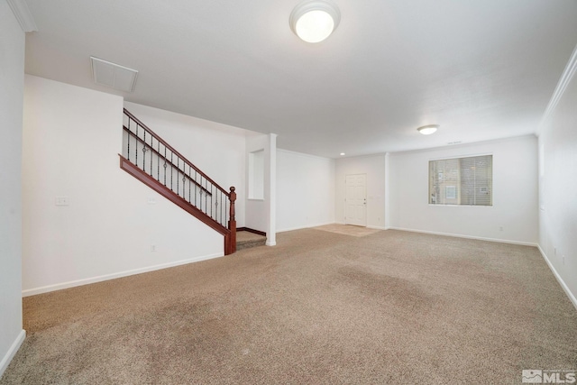 unfurnished living room with crown molding, visible vents, carpet flooring, baseboards, and stairs