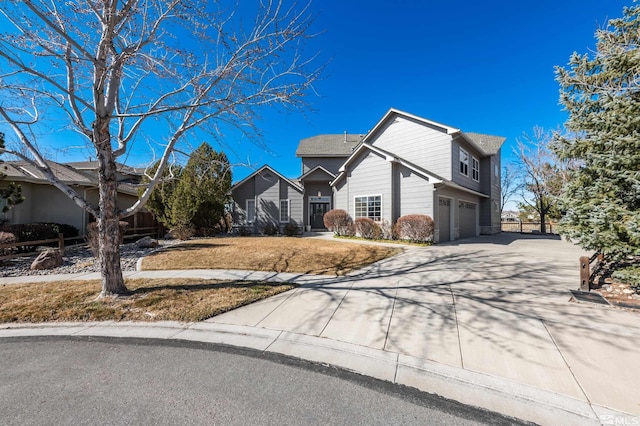 view of home's exterior with a residential view, concrete driveway, a yard, and an attached garage