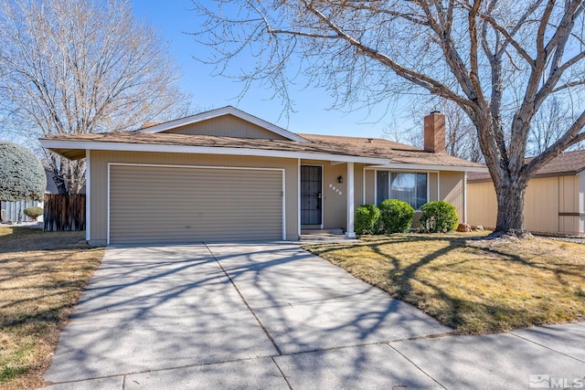 ranch-style house featuring a garage, concrete driveway, a chimney, and a front lawn