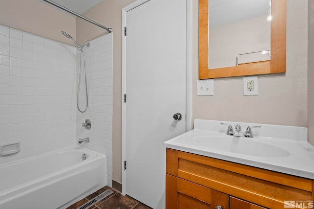 full bath with visible vents, tub / shower combination, and vanity