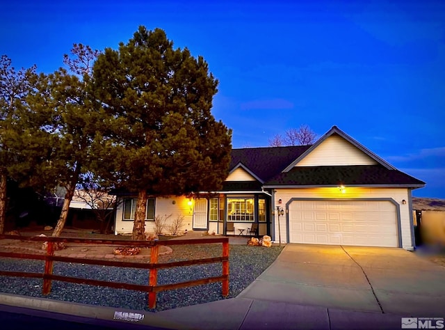 single story home featuring driveway and a garage