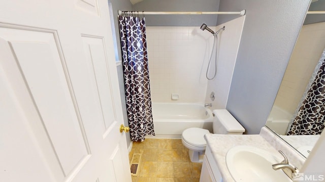 bathroom with shower / tub combo, vanity, and toilet