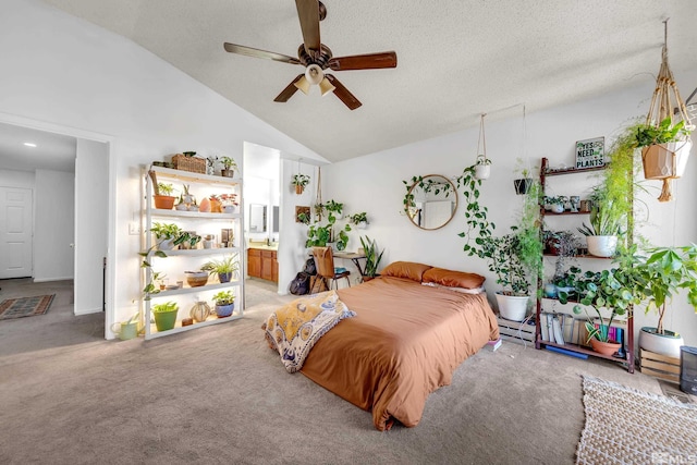 bedroom with light carpet, high vaulted ceiling, a textured ceiling, and ensuite bathroom