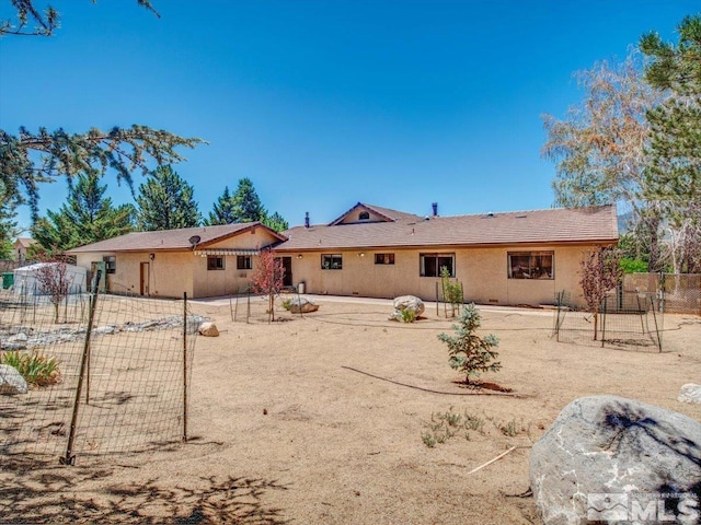 back of property with a patio area, fence, and stucco siding