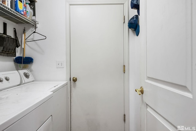 laundry room featuring laundry area and washer and clothes dryer