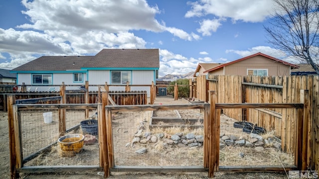 exterior space with a garden and fence