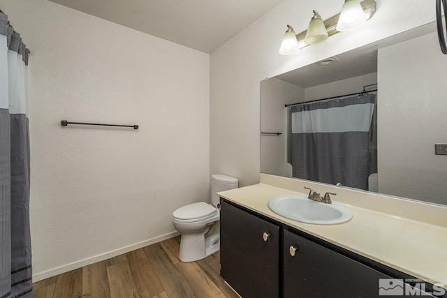 full bathroom with toilet, wood finished floors, vanity, baseboards, and a shower with curtain