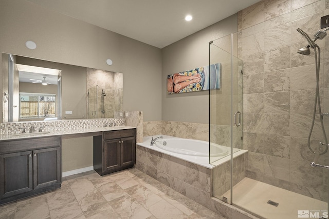 bathroom with a stall shower, tasteful backsplash, ceiling fan, a garden tub, and vanity