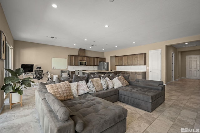 living room with visible vents and recessed lighting