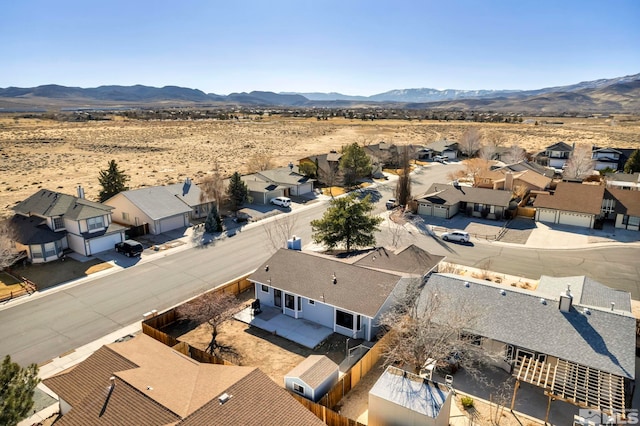 bird's eye view featuring a residential view, view of desert, and a mountain view