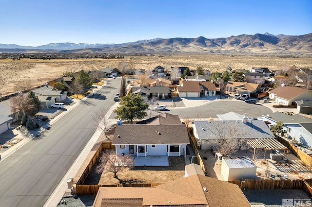 drone / aerial view featuring a mountain view and a residential view