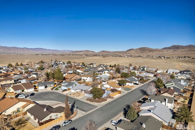 birds eye view of property featuring a mountain view and a residential view